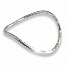 ODDIE & HOPE sterling silver wave bangle with hammered texture. A unique, flowing design for everyday elegance.